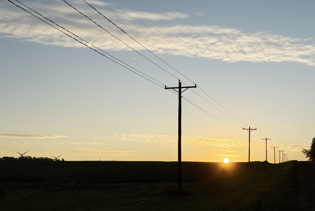 Sunrise in Brookings County by powerlines