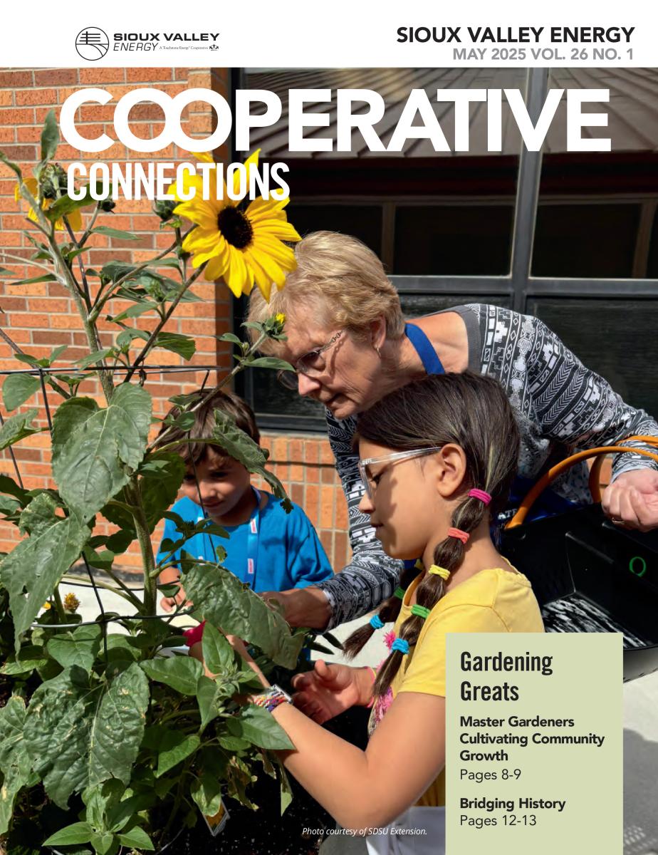 Cover of May magazine showing woman and children in garden