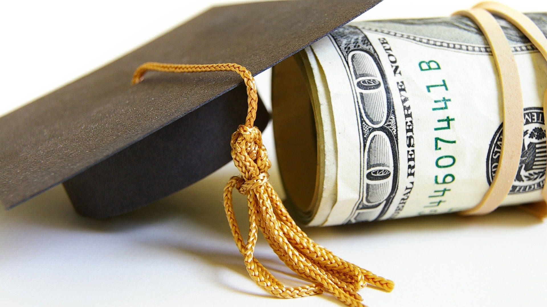 Graduation cap with money scholarships