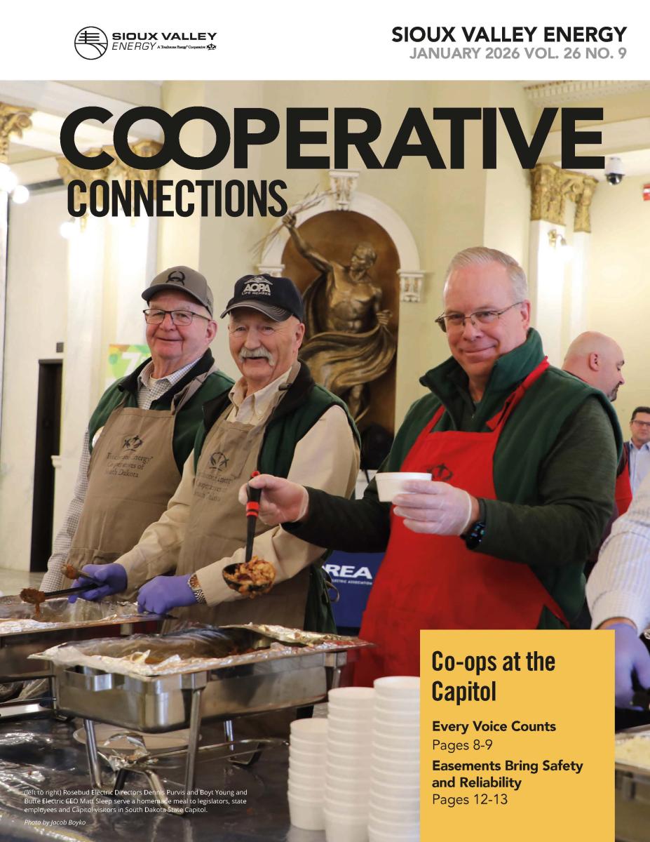 January 2026 magazine cover showing three men serving food in South Dakota Capitol building rotunda