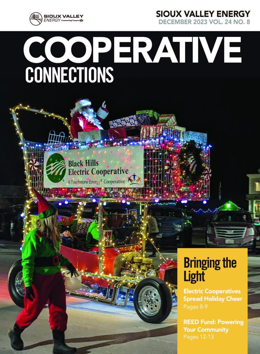 December 2023 Magazine Cover featuring parade of lights entry