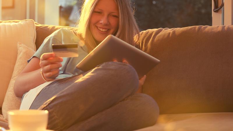 Lady on tablet with card