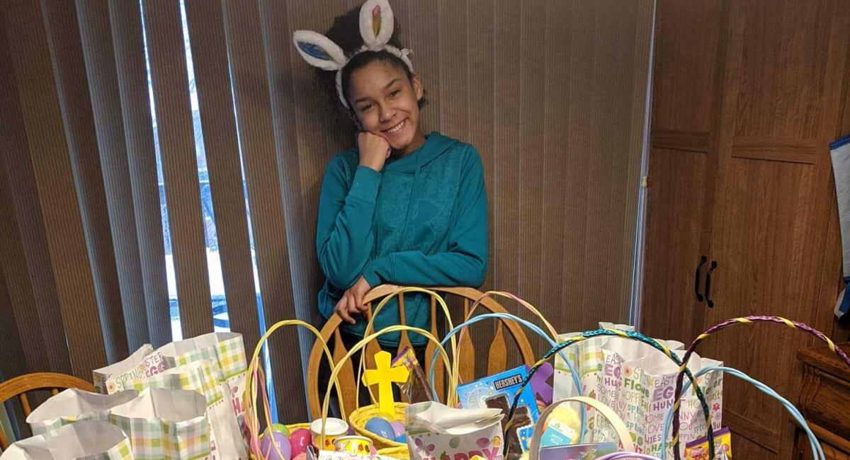 Jaydn poses with Easter baskets she made.